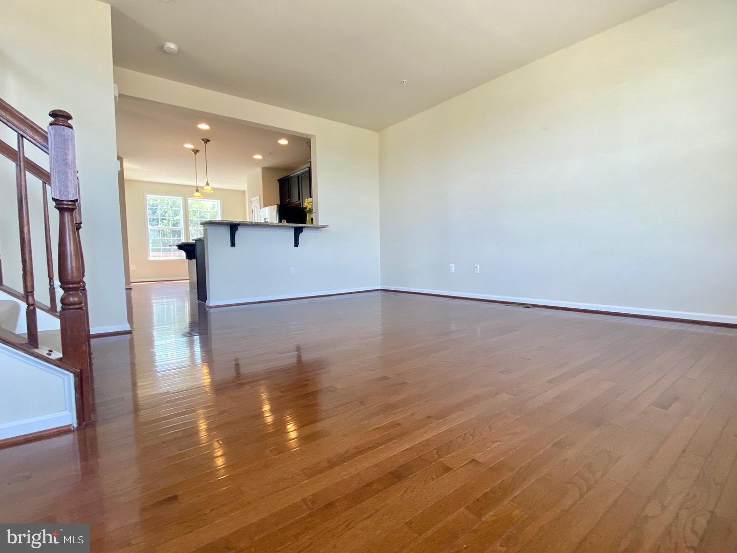 1100 Frontline Drive Frederick, MD 21703 - Photo 4 of 19 a view of a kitchen with wooden floor and a kitchen