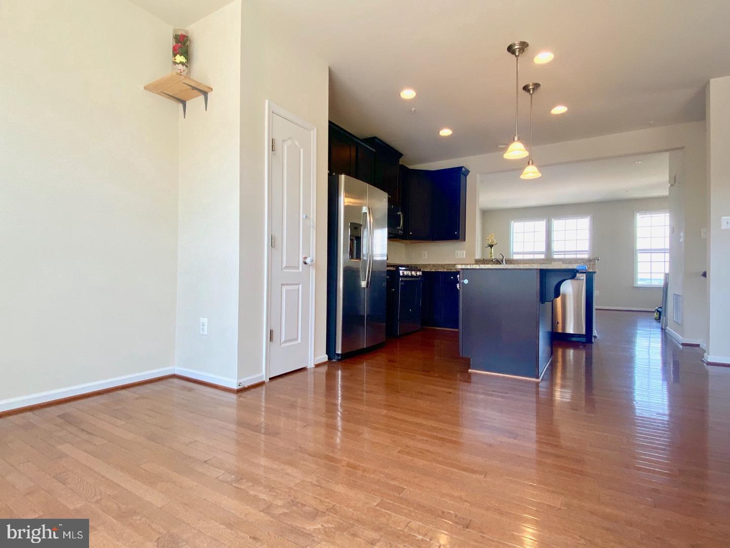 1100 Frontline Drive Frederick, MD 21703 - Photo 5 of 19 a view of kitchen with cabinets and wooden floor