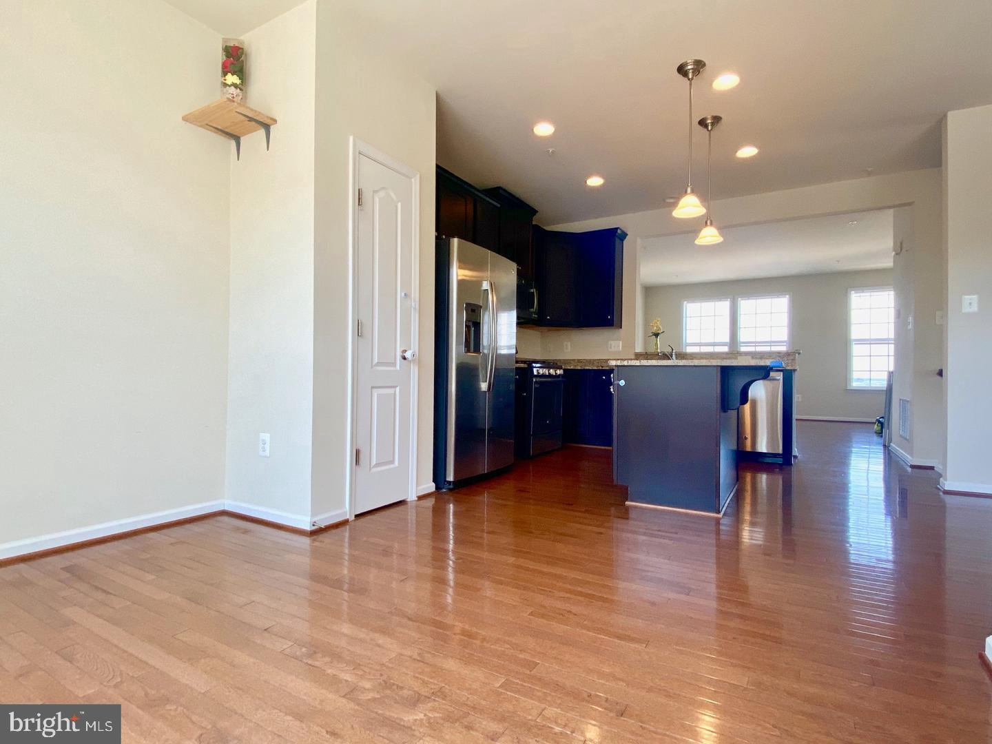 1100 Frontline Drive Frederick, MD 21703 - Photo 6 of 19 a view of kitchen with cabinets and wooden floor