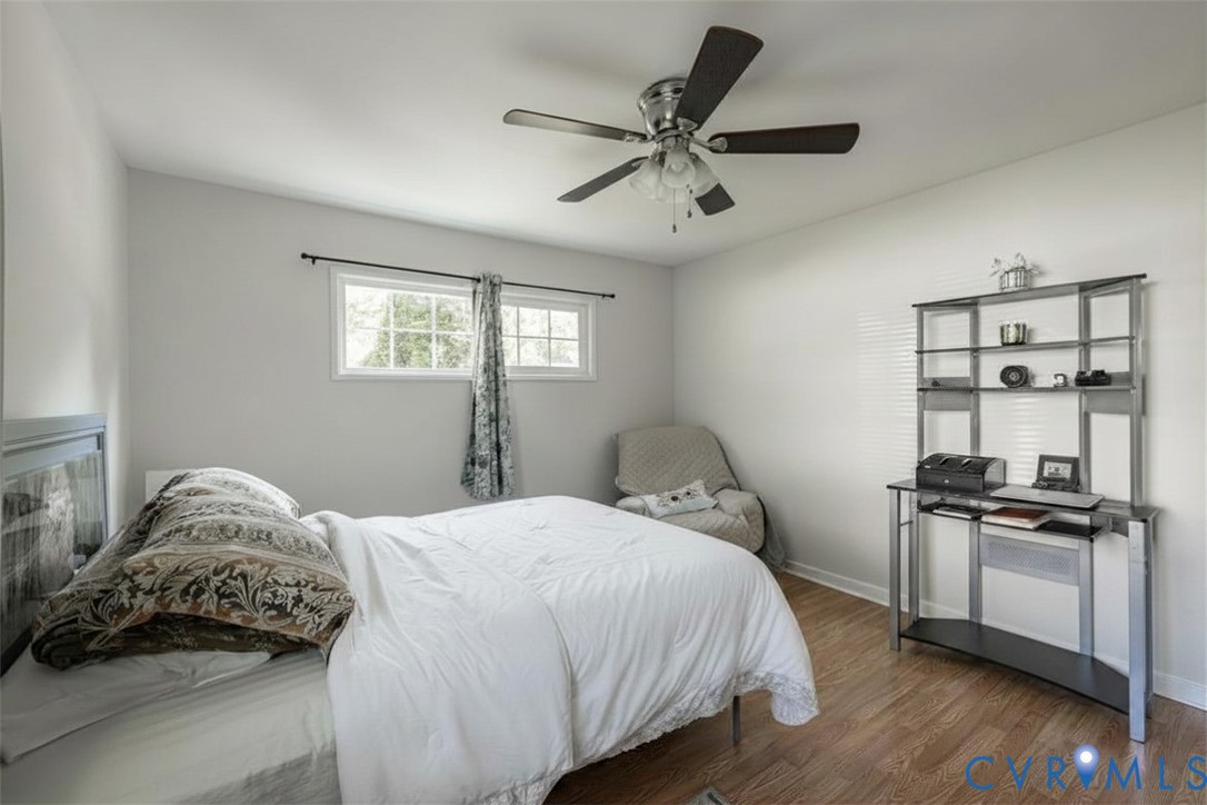 9217 Fisk Road Richmond, VA 23229 - Photo 21 of 39 a bedroom with a bed and a window