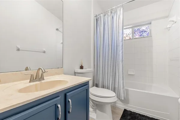 a bathroom with a sink a toilet and a bathtub