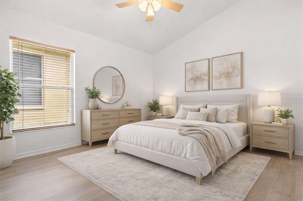 11478 Weston Course Loop Riverview, FL 33579 - Photo 12 of 22 a bedroom with a bed a mirror and a window