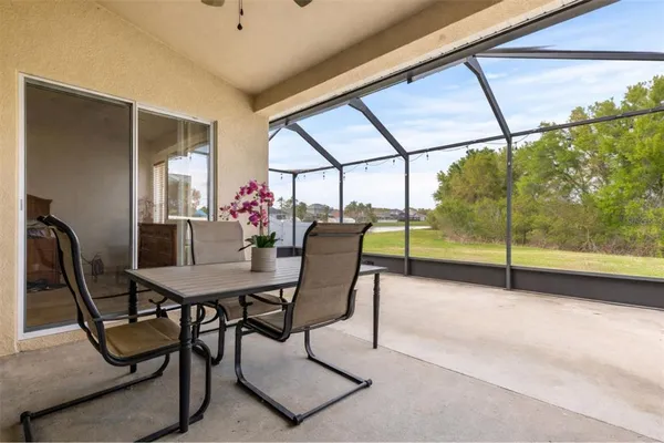 a view of a dining room with furniture window and outside view