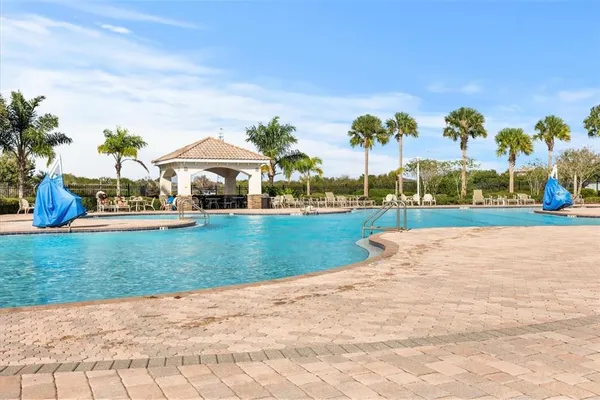 a view of outdoor space with playground and green space