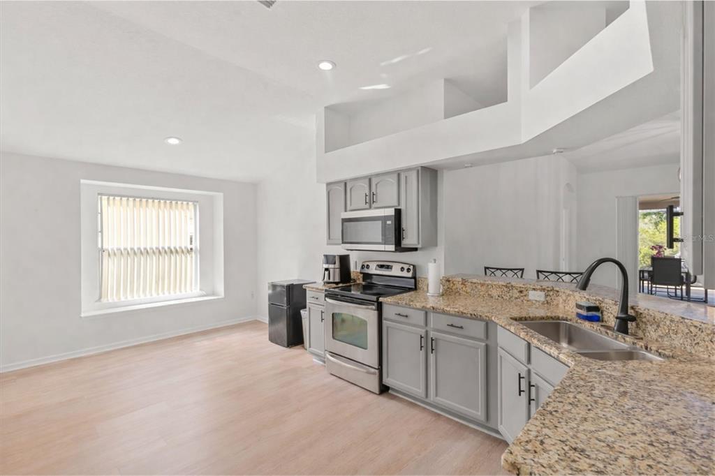 11478 Weston Course Loop Riverview, FL 33579 - Photo 5 of 22 a kitchen with a sink appliances and cabinets