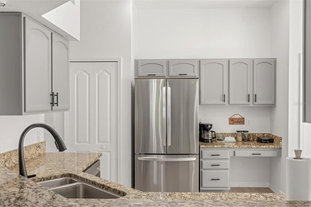 11478 Weston Course Loop Riverview, FL 33579 - Photo 6 of 22 a kitchen with cabinets and refrigerator