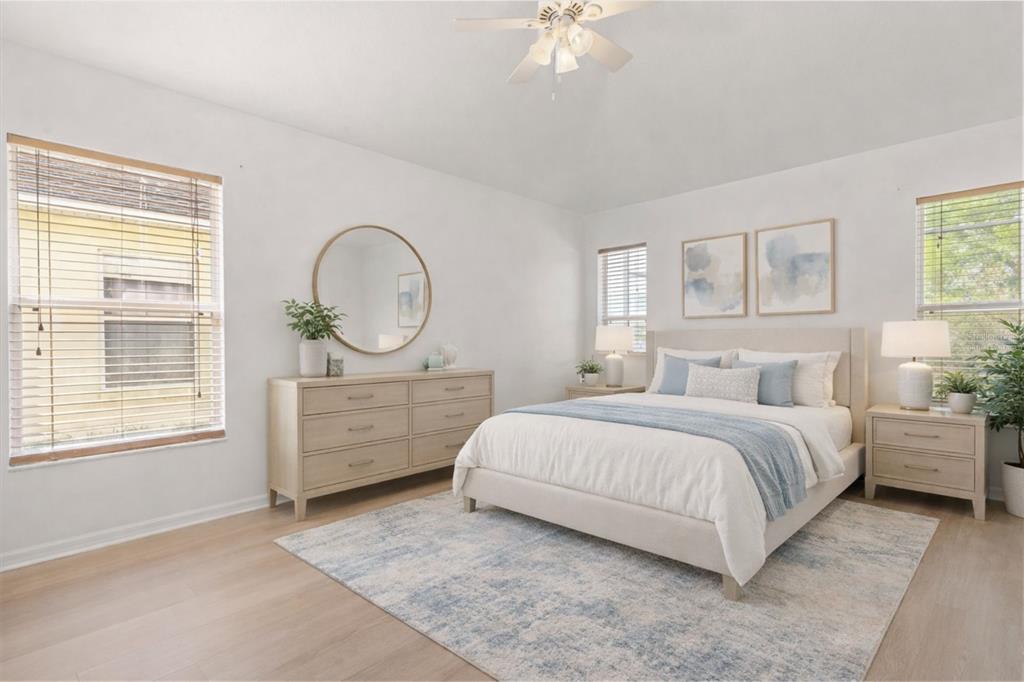 11478 Weston Course Loop Riverview, FL 33579 - Photo 10 of 22 a bed room with a bed a dresser and a window