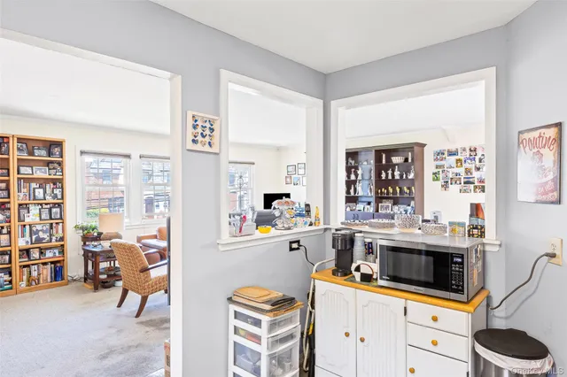 a view of a livingroom with furniture and a flat screen tv