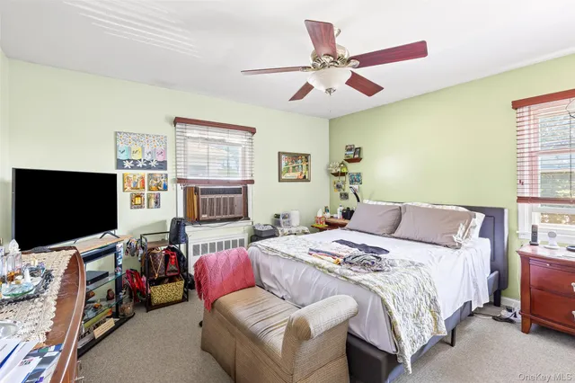 a bathroom with a sink mirror vanity and toilet