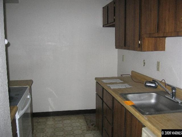 4448 Matich Drive Reno, NV 89502 - Photo 2 of 6 a kitchen with a sink a stove and cabinets