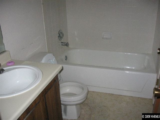 4448 Matich Drive Reno, NV 89502 - Photo 3 of 6 a bathroom with a sink a toilet and bathtub