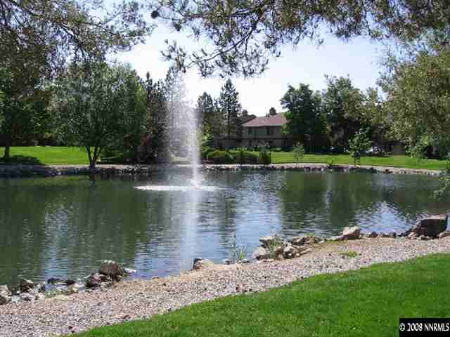 4448 Matich Drive Reno, NV 89502 - Photo 6 of 6 a view of a lake with a house in the background