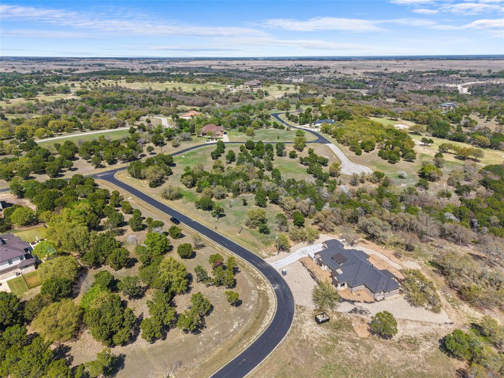 an aerial view of a residential houses with outdoor space