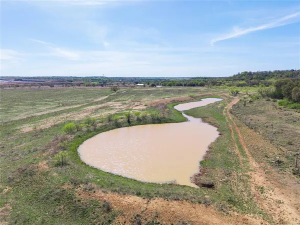 a view of a lake with a big yard