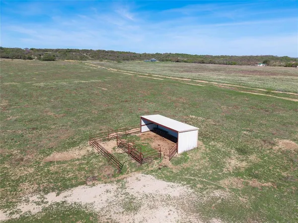 a view of a lake with a yard