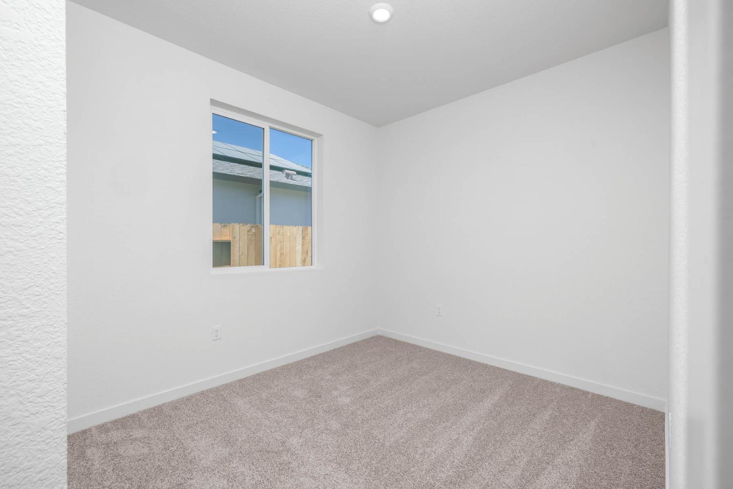 3041 Isley Way Stockton, CA 95212 - Photo 5 of 10 an empty room with a window