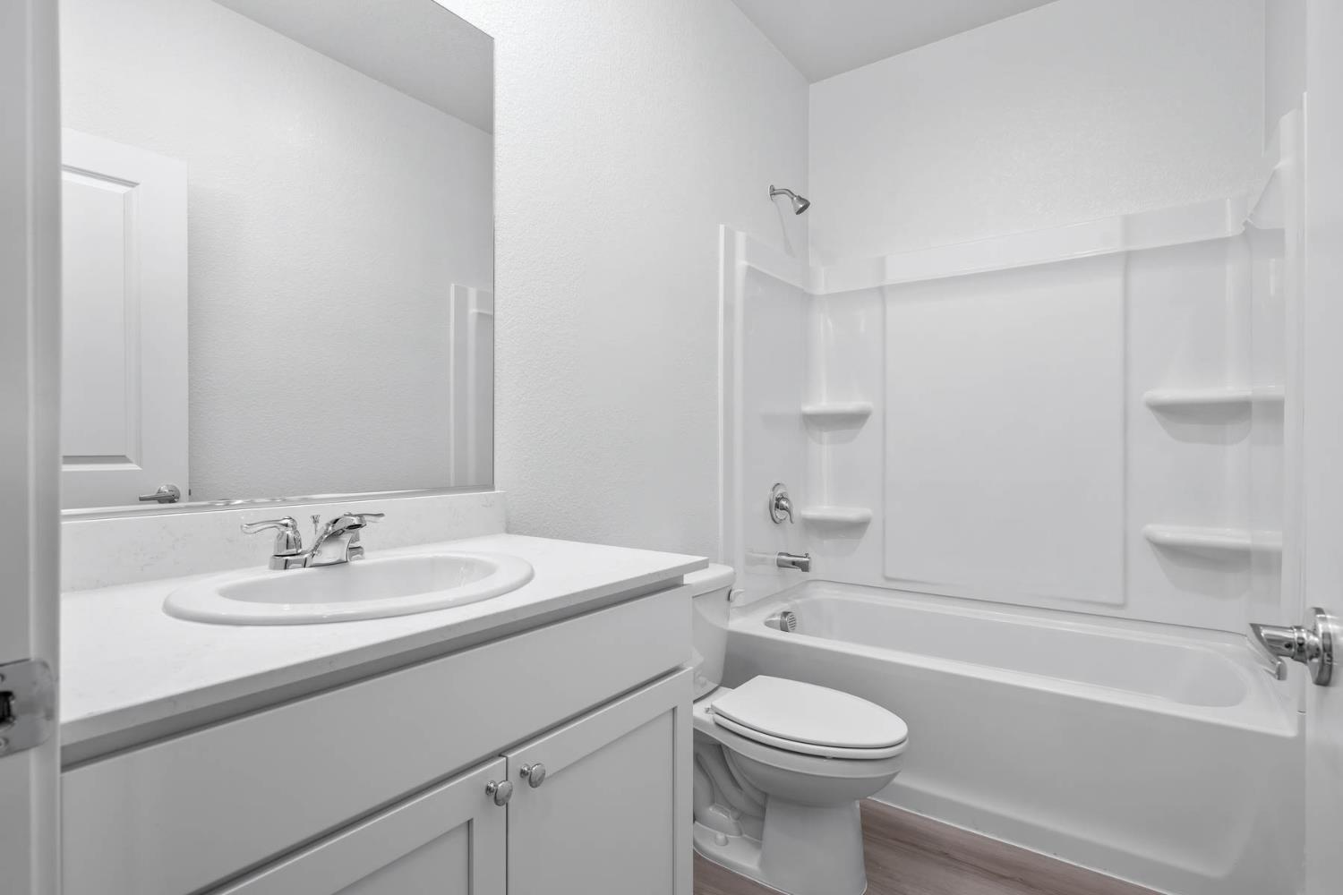 3041 Isley Way Stockton, CA 95212 - Photo 8 of 10 a bathroom with a sink a toilet and a bathtub