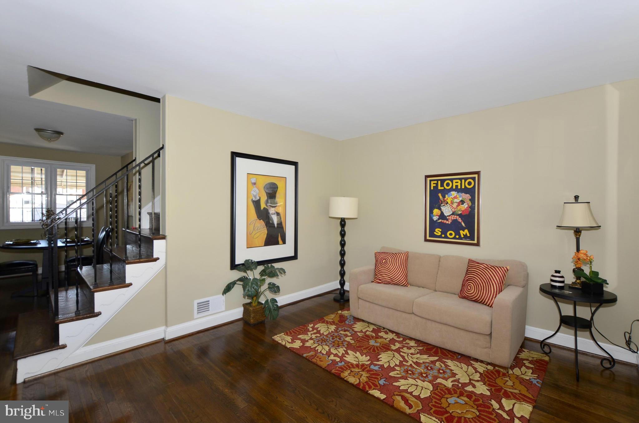 8253 Kavanagh Road Baltimore, MD 21222 - Photo 12 of 29 a living room with furniture and wooden floor