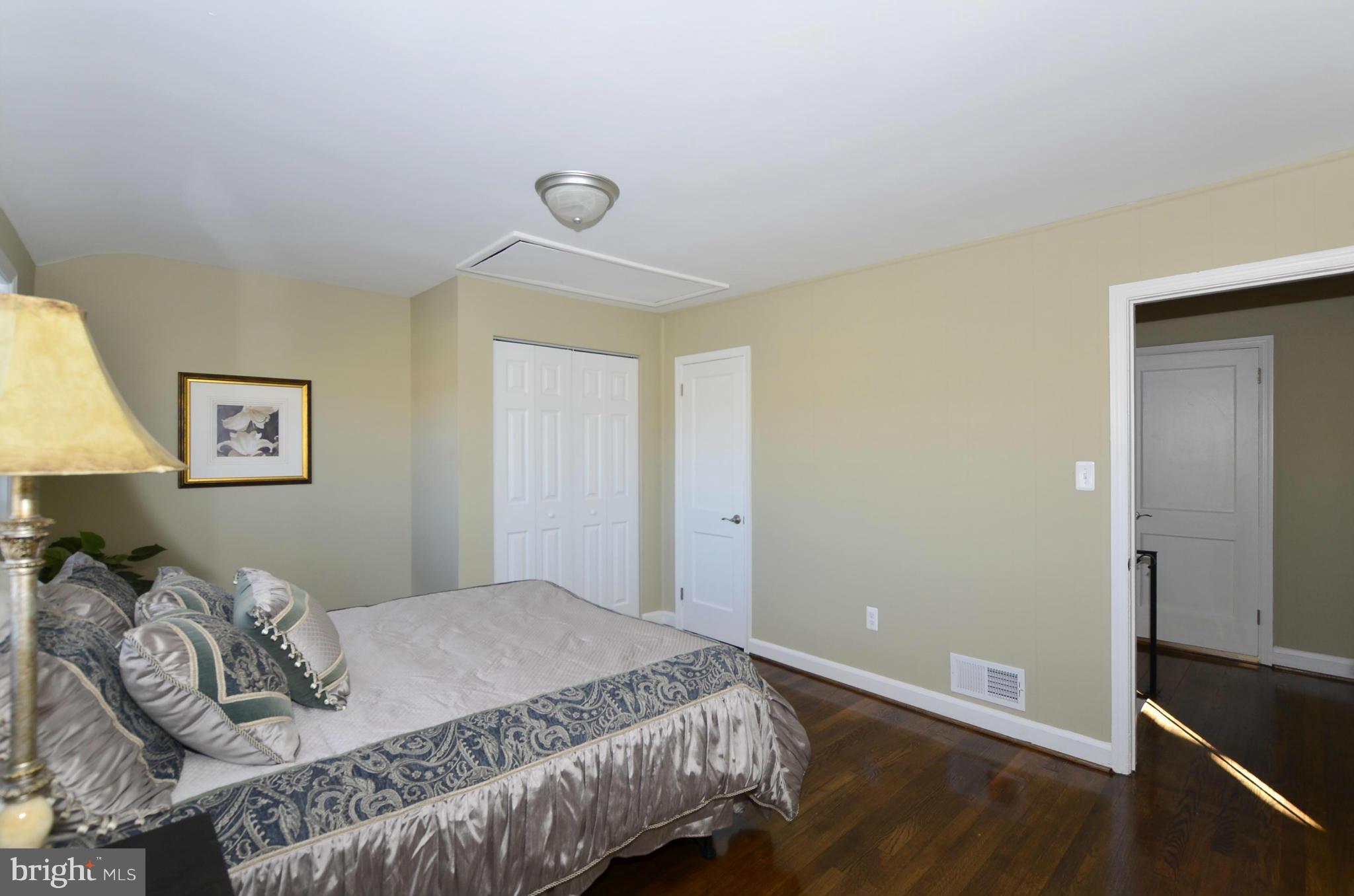 8253 Kavanagh Road Baltimore, MD 21222 - Photo 17 of 29 a bedroom with a bed and a window