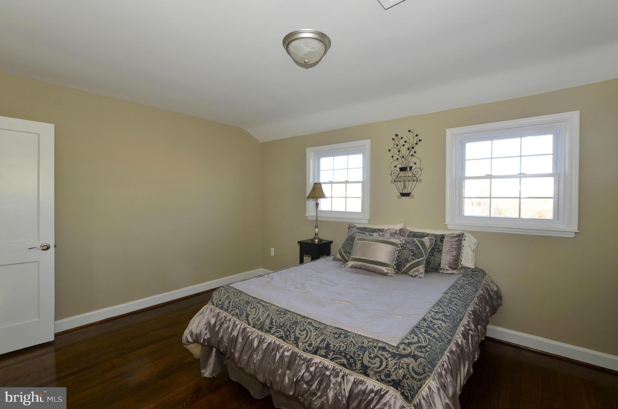8253 Kavanagh Road Baltimore, MD 21222 - Photo 18 of 29 a bedroom with a bed and window