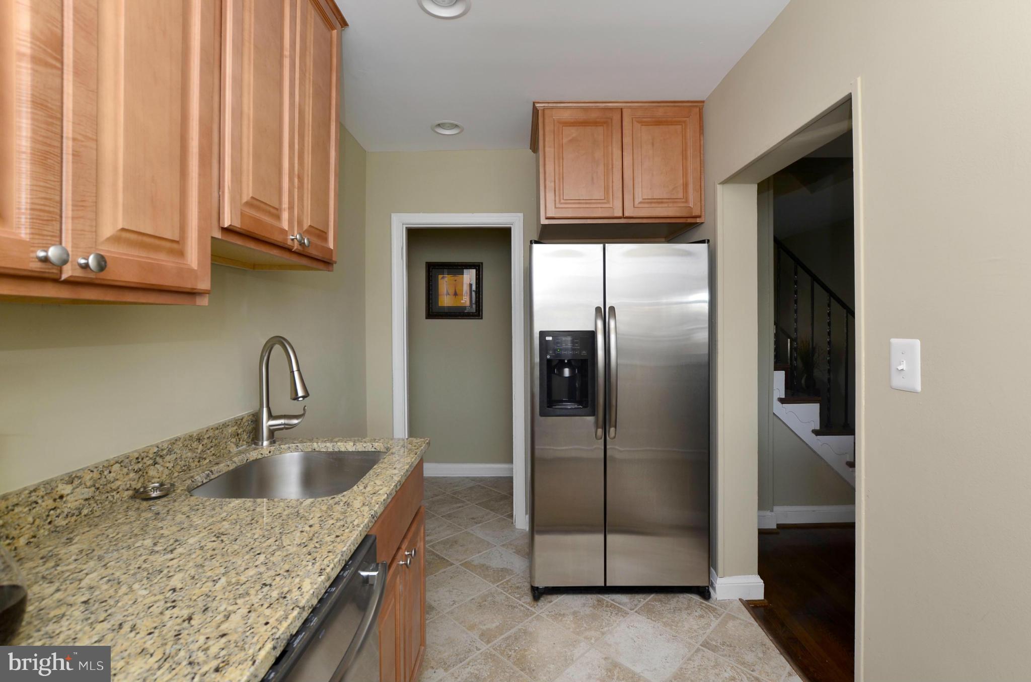 8253 Kavanagh Road Baltimore, MD 21222 - Photo 4 of 29 a kitchen with stainless steel appliances granite countertop a refrigerator a sink and dishwasher