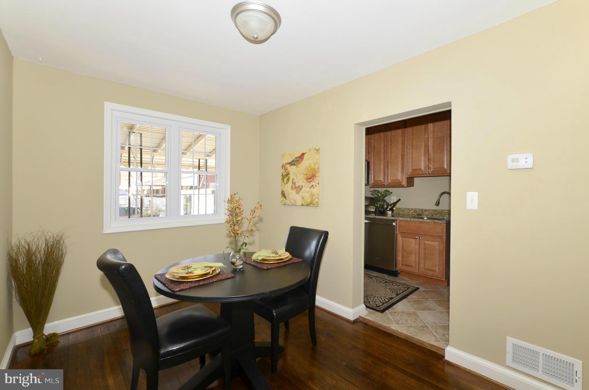 8253 Kavanagh Road Baltimore, MD 21222 - Photo 5 of 29 a view of a dining room with furniture and wooden floor