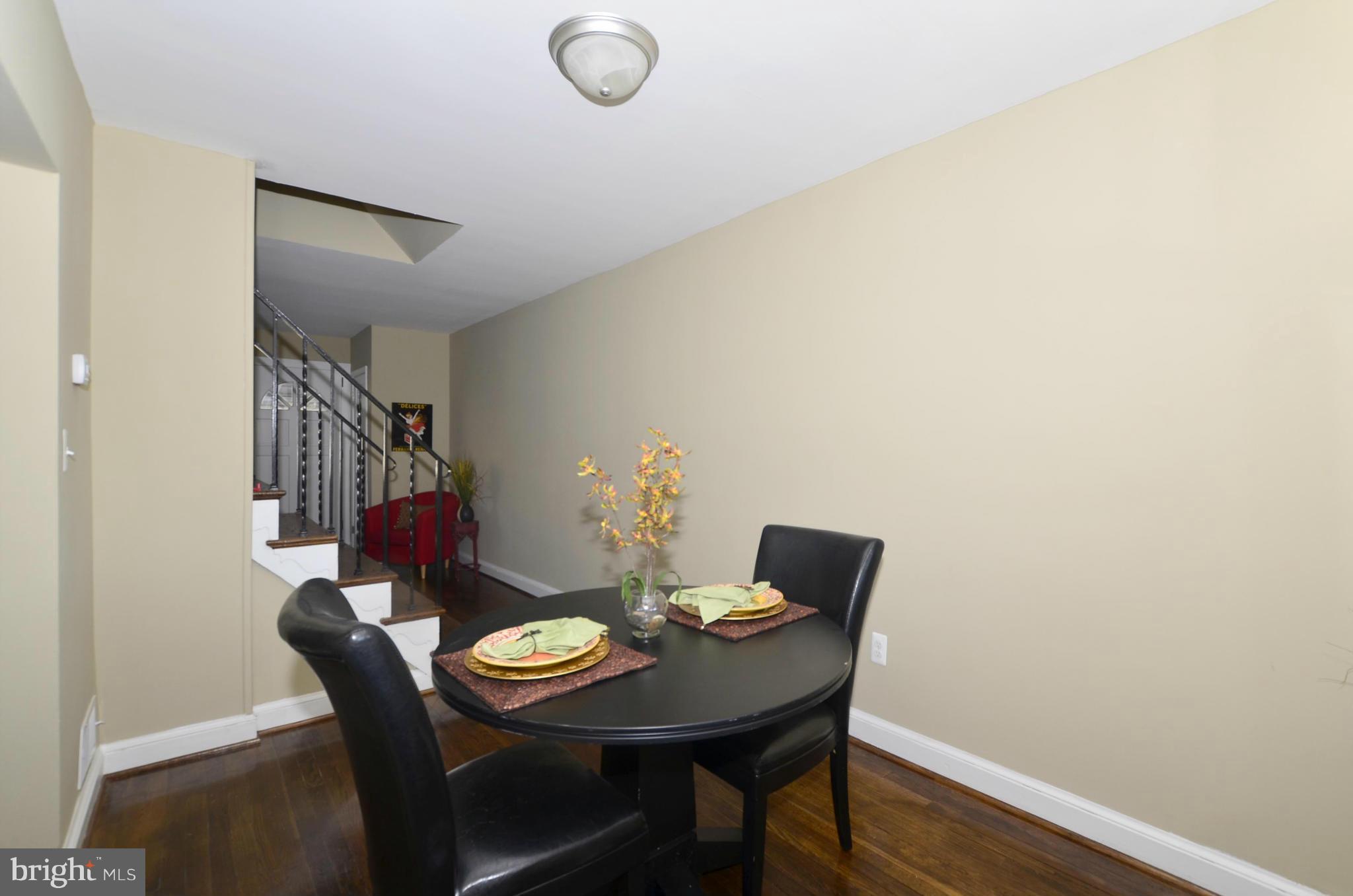 8253 Kavanagh Road Baltimore, MD 21222 - Photo 6 of 29 a view of a dining room with furniture and wooden floor