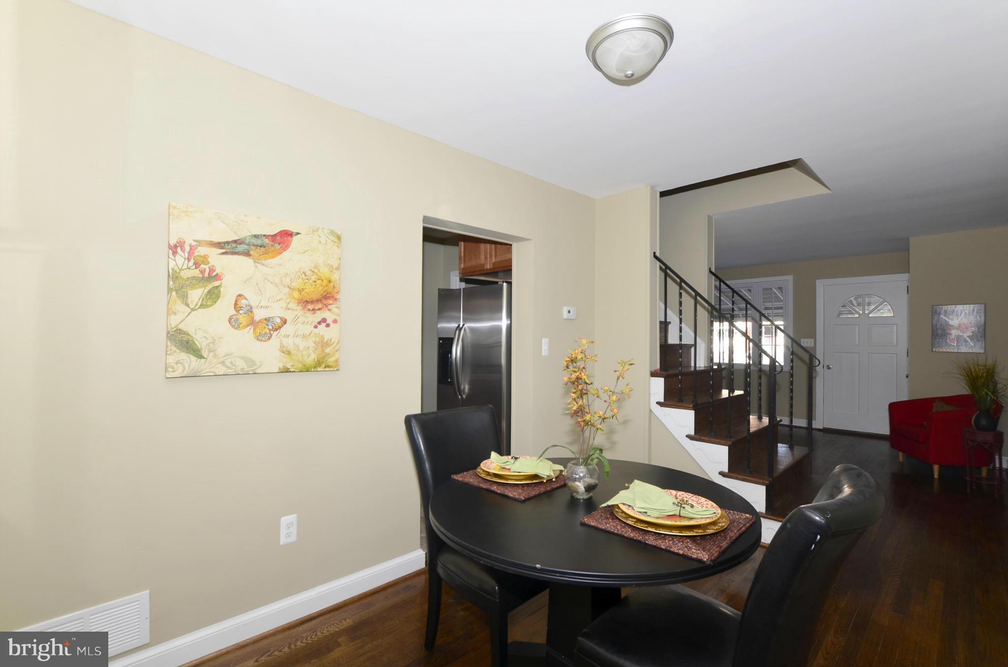 8253 Kavanagh Road Baltimore, MD 21222 - Photo 7 of 29 a view of a dining room with furniture and wooden floor
