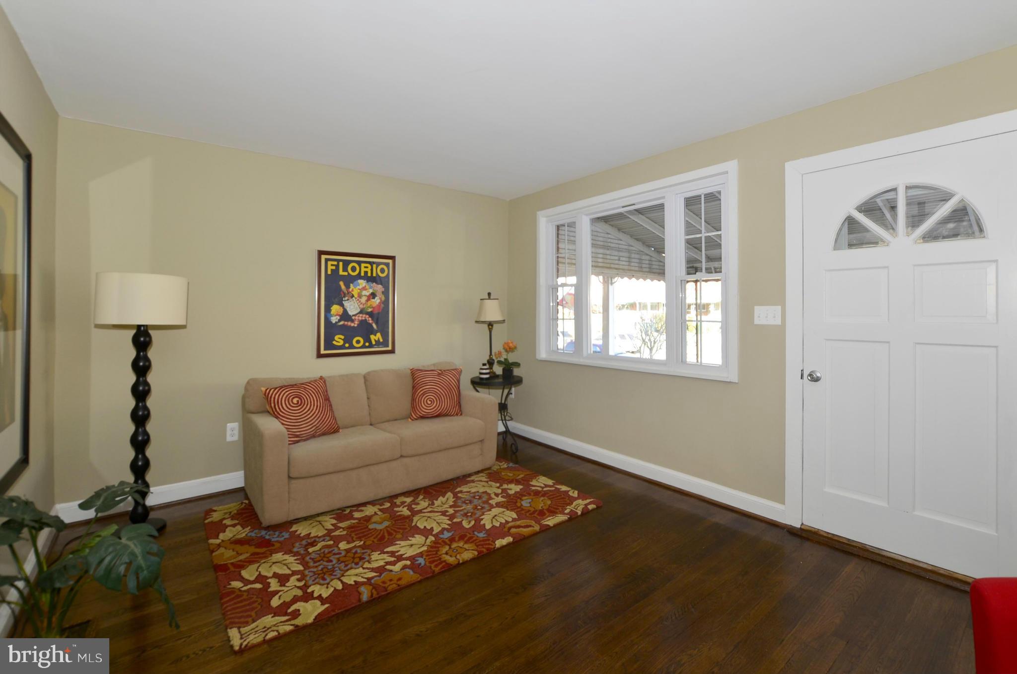 8253 Kavanagh Road Baltimore, MD 21222 - Photo 8 of 29 a living room with furniture and a window