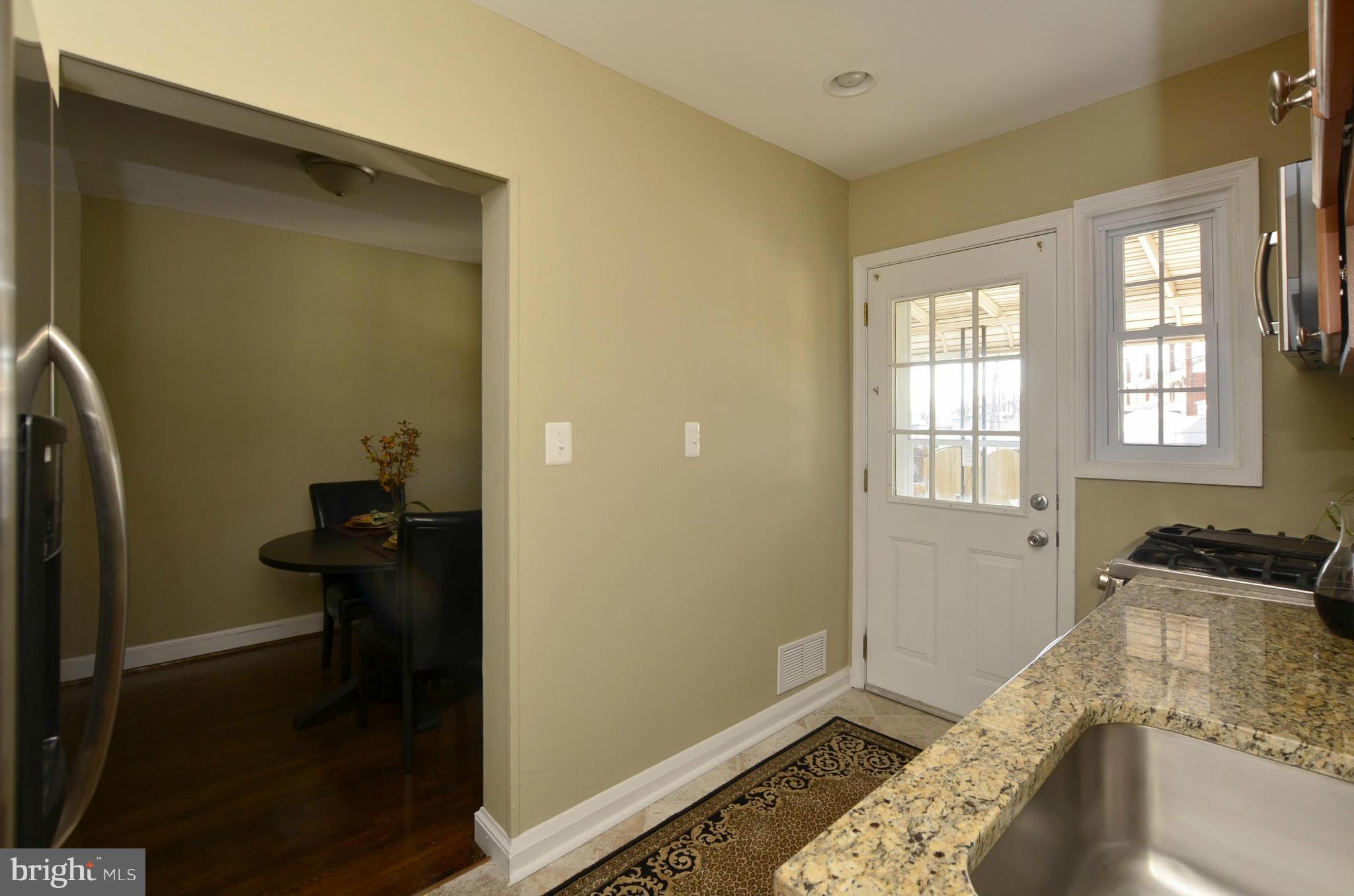 8253 Kavanagh Road Baltimore, MD 21222 - Photo 9 of 29 a bedroom with a bed and wooden floor