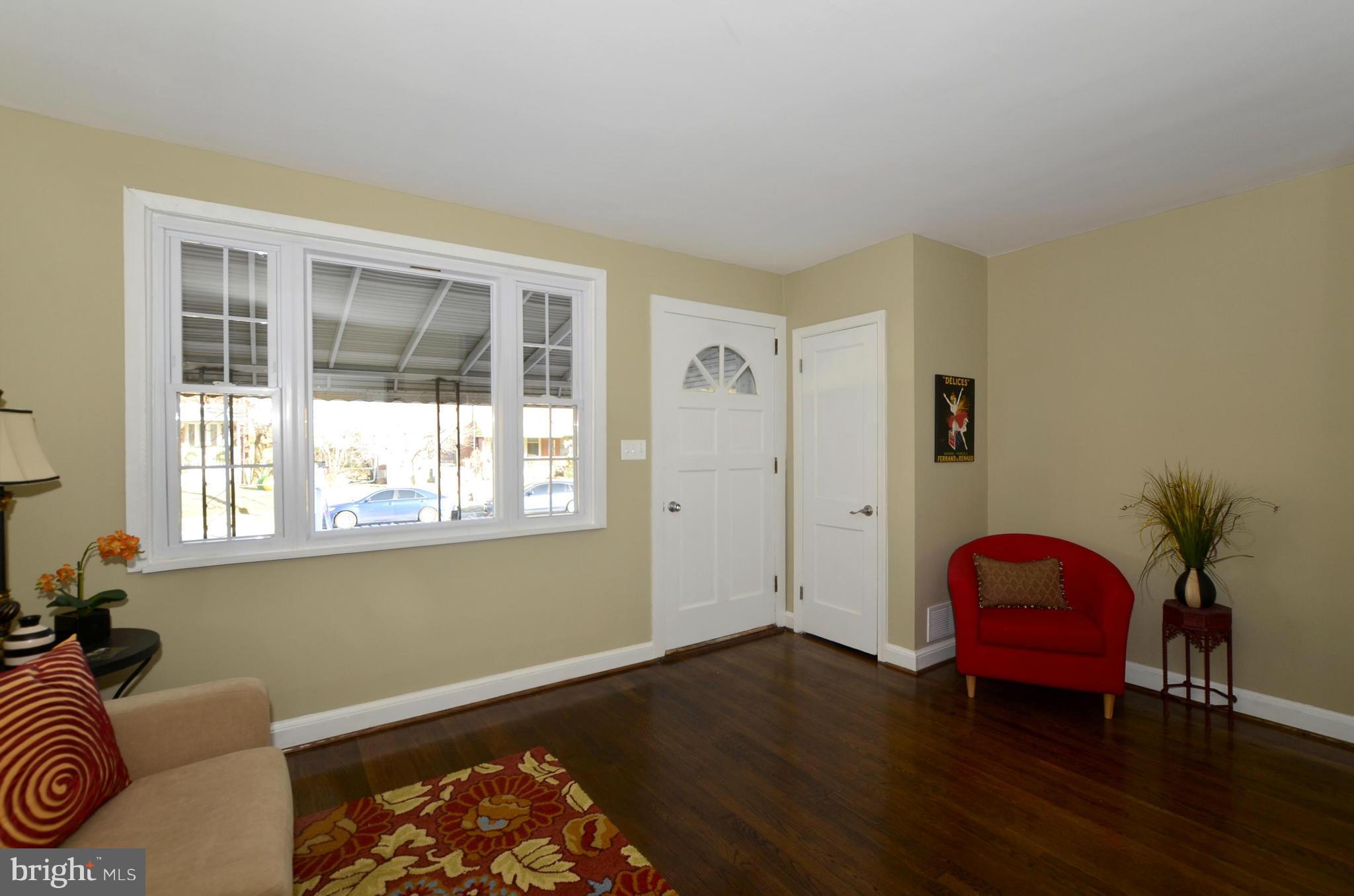 8253 Kavanagh Road Baltimore, MD 21222 - Photo 10 of 29 a living room with a bed and a window