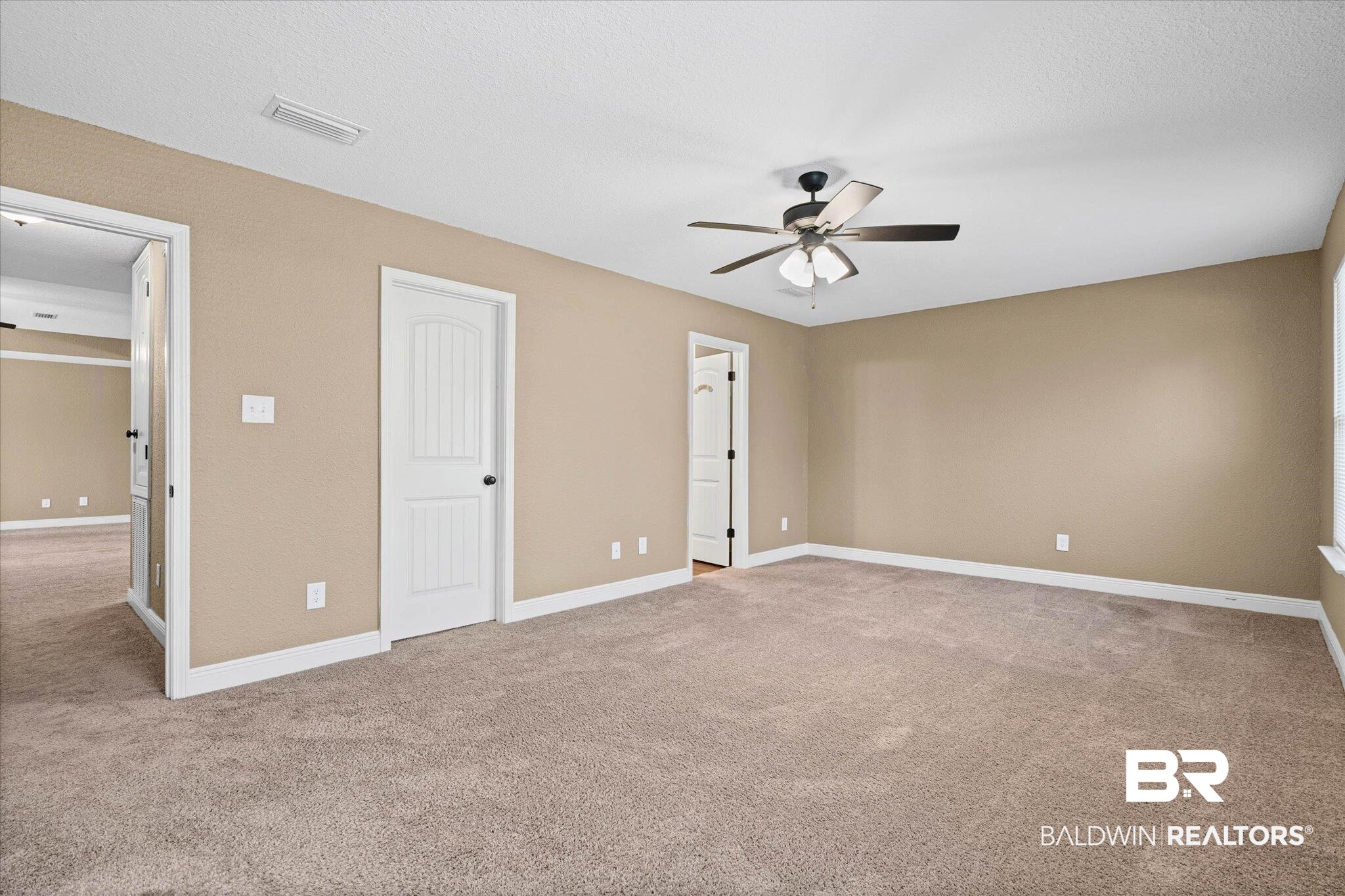 101 Washington Boulevard Foley, AL 36535 - Photo 13 of 32 Unfurnished bedroom with light carpet and ceiling fan