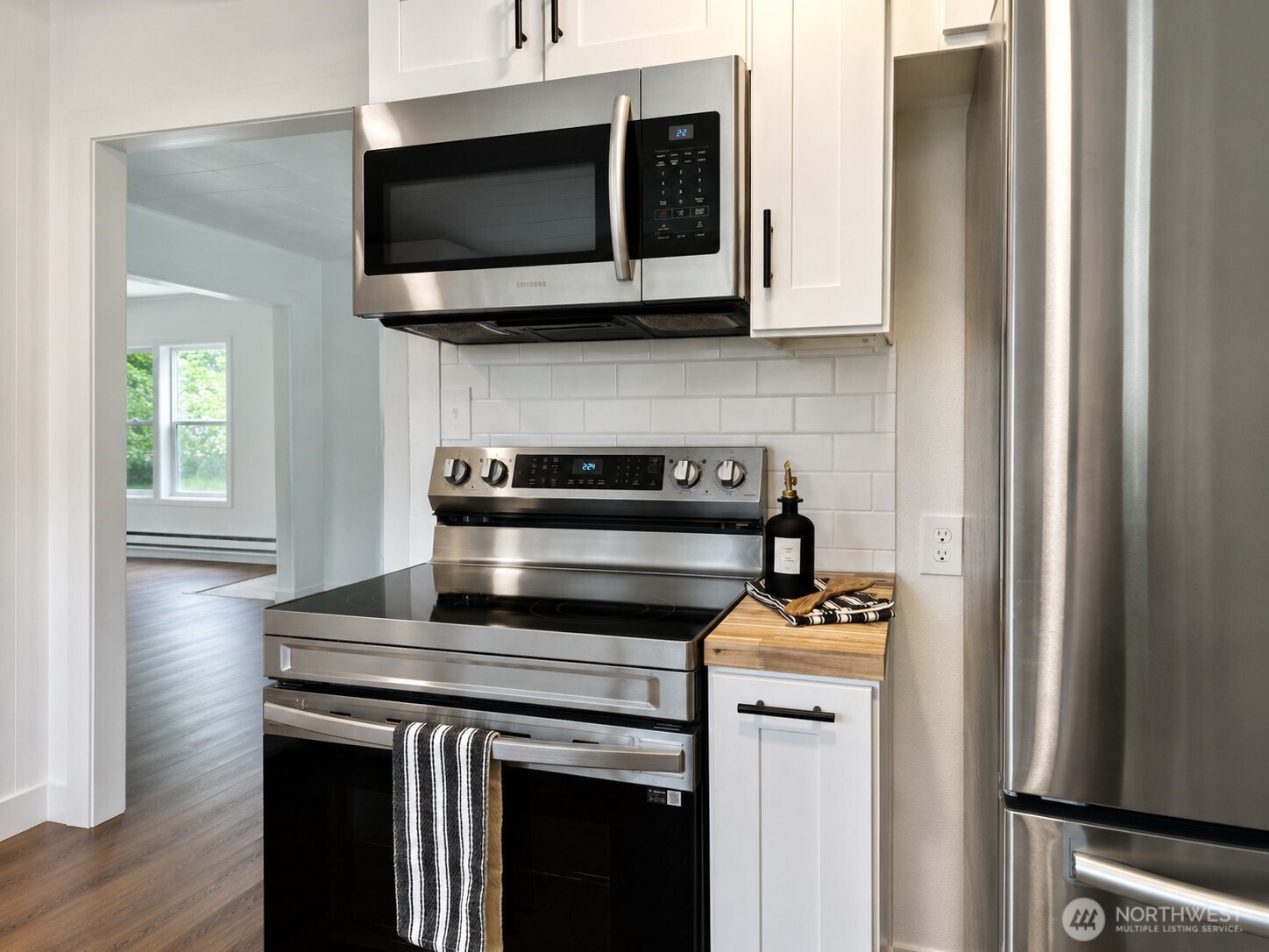 2222 Cooks Hill Road Centralia, WA 98531 - Photo 8 of 36 a kitchen with stainless steel appliances a stove microwave and cabinets