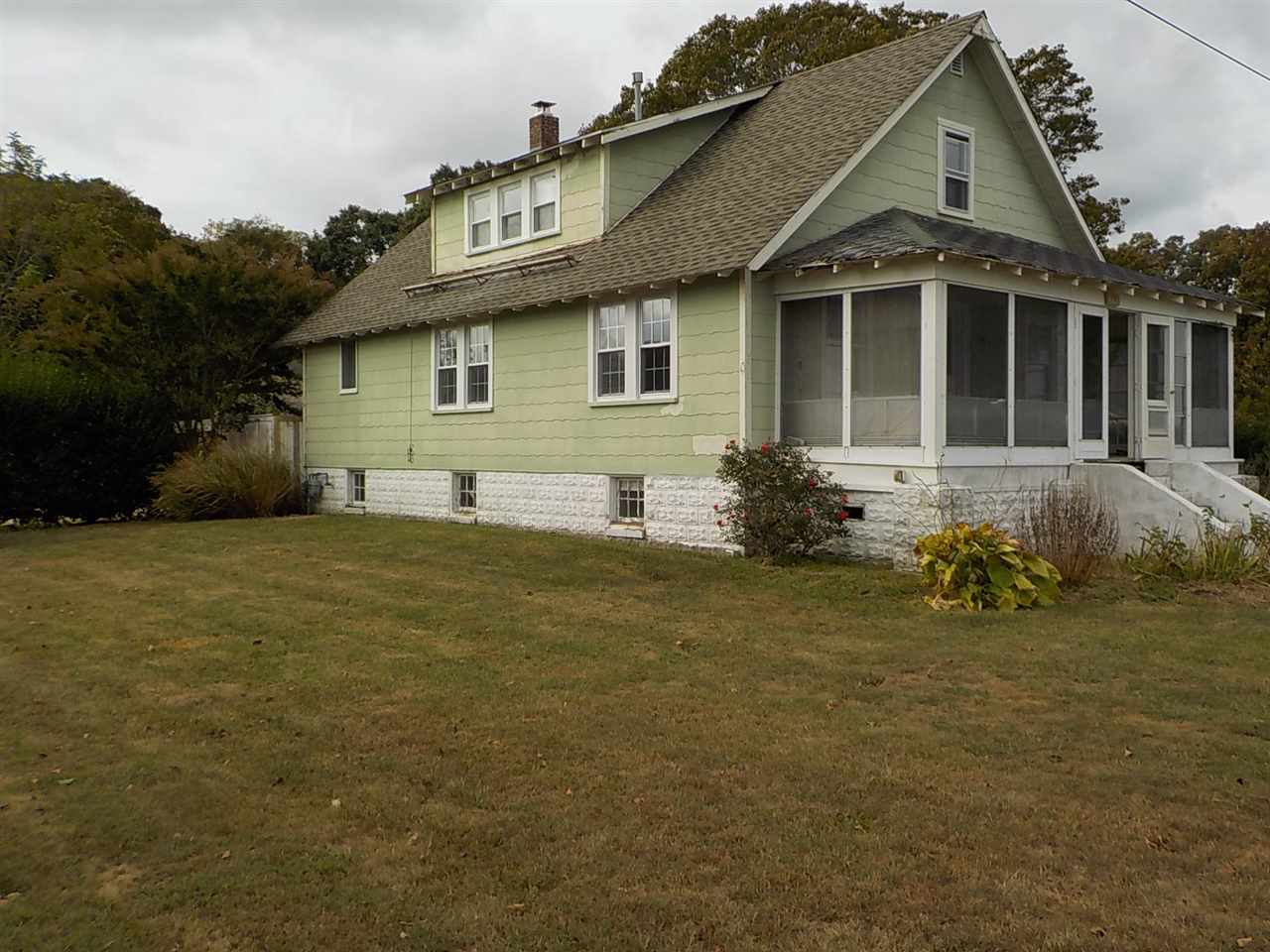 714 New England Road Cape May, NJ 08204 - Photo 1 of 1 a front view of a house with a garden