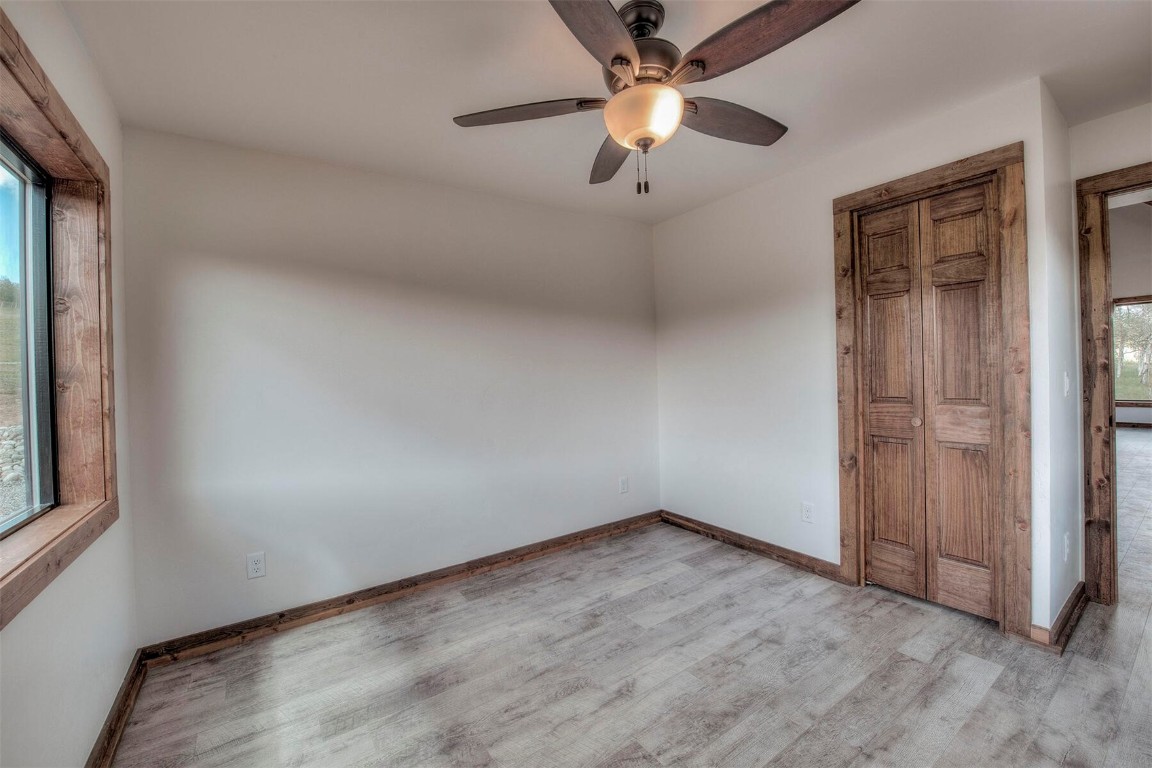 1835 Sheep Ridge Road Fairplay, CO 80440 - Photo 15 of 34 an empty room with windows and fan