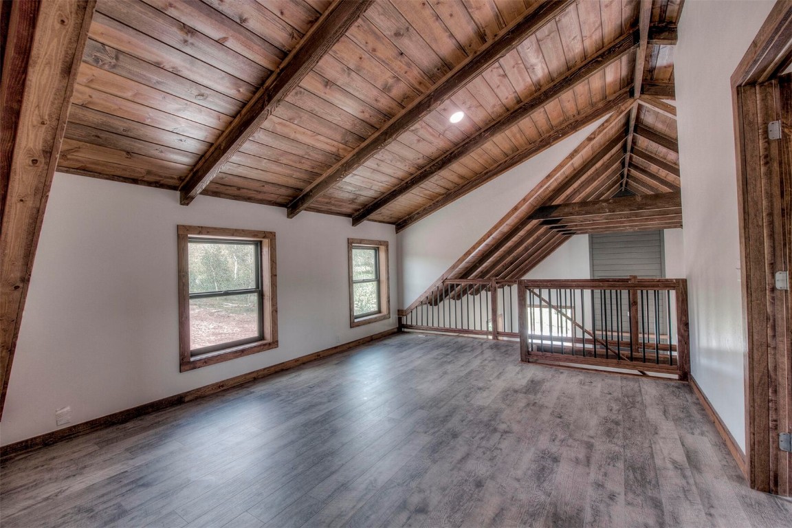 1835 Sheep Ridge Road Fairplay, CO 80440 - Photo 17 of 34 a view of an empty room with wooden floor and a window