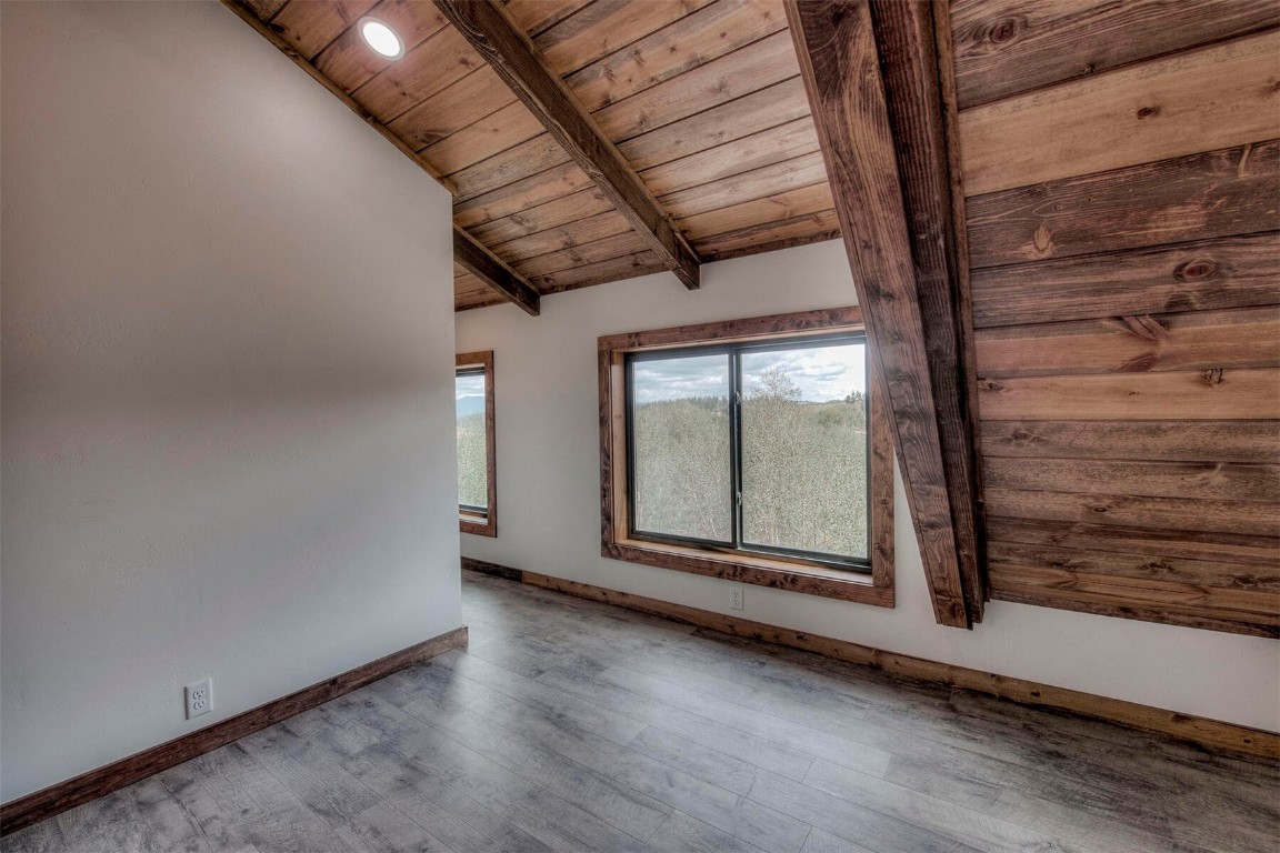 1835 Sheep Ridge Road Fairplay, CO 80440 - Photo 19 of 34 a view of an empty room with wooden floor and a window