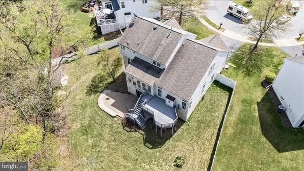 an aerial view of a house with a garden