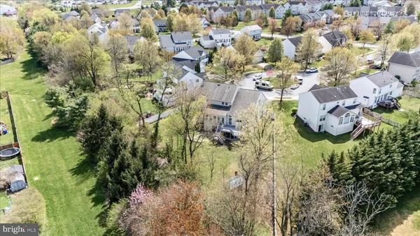 an aerial view of houses with outdoor space