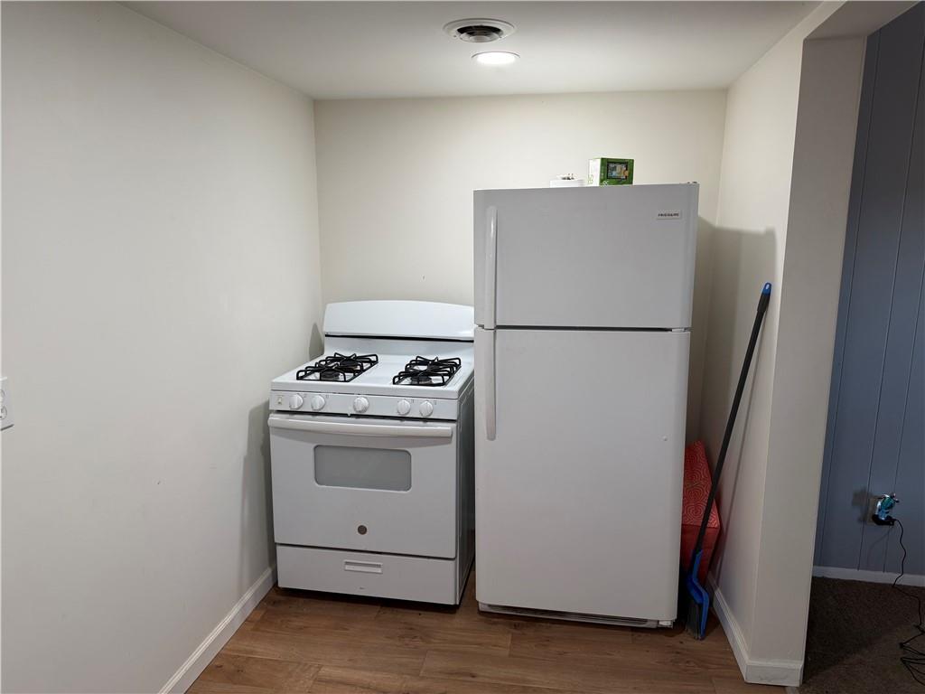 525 Franklin Street Freeport, PA 16229 - Photo 3 of 25 a white refrigerator freezer a stove and a refrigerator
