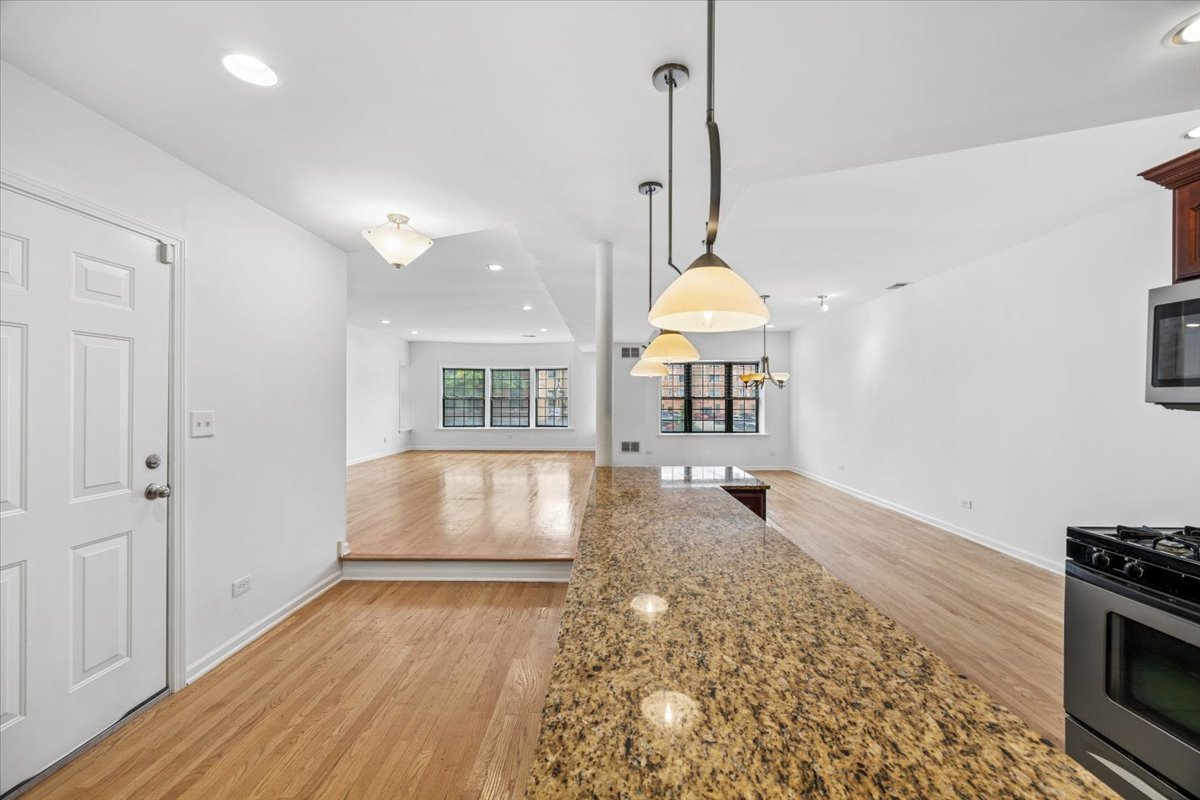 2363 East 70th Street, Unit 1 Chicago, IL 60649 - Photo 3 of 26 a view of an empty room and window