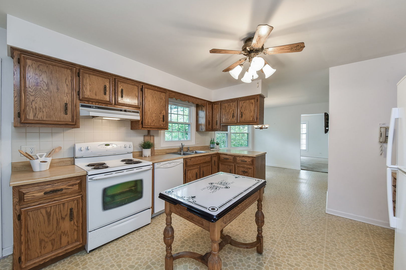 1191 East Gartner Road Naperville, IL 60540 - Photo 3 of 24 a kitchen with a stove a sink and a refrigerator