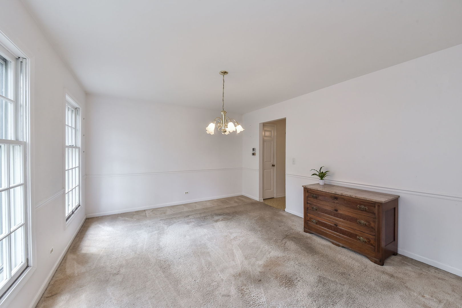 1191 East Gartner Road Naperville, IL 60540 - Photo 9 of 24 wooden floor in an empty room with a window