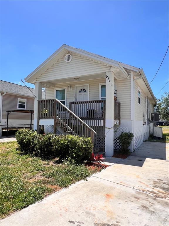 5351 Leisure Lane New Port Richey, FL 34652 - Photo 3 of 12 a front view of a house with garden