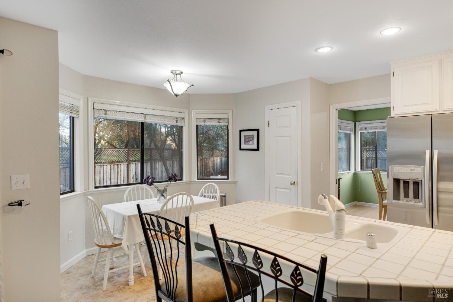 504 Jenifer Court Santa Rosa, CA 95404 - Photo 25 of 61 a view of a dining room with furniture window and outside view