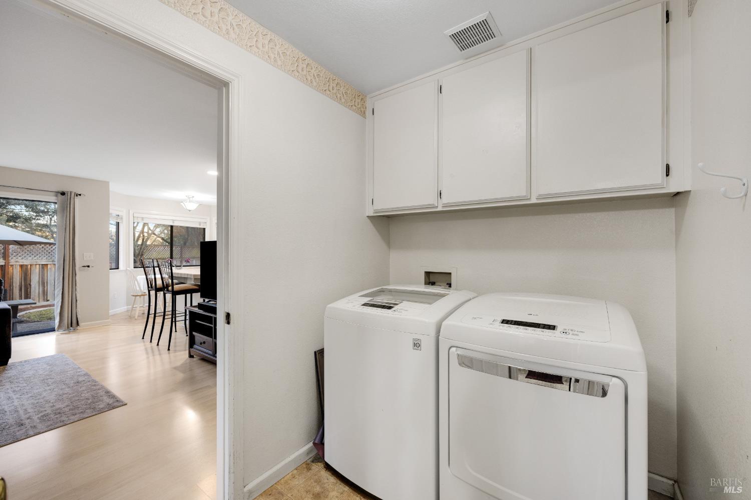 504 Jenifer Court Santa Rosa, CA 95404 - Photo 30 of 61 a utility room with dryer washer and a view of living room