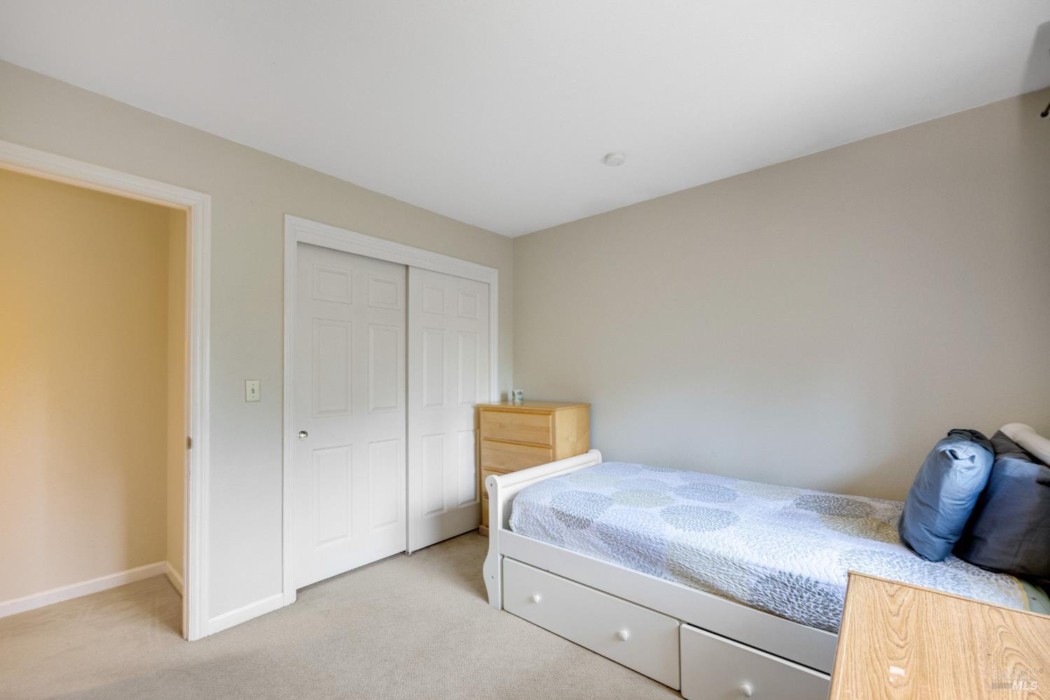 504 Jenifer Court Santa Rosa, CA 95404 - Photo 42 of 61 a bedroom with a bed and window