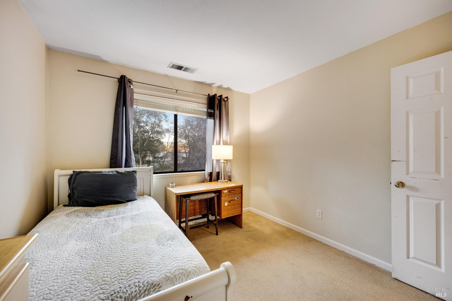 504 Jenifer Court Santa Rosa, CA 95404 - Photo 43 of 61 a bedroom with a bed and large window