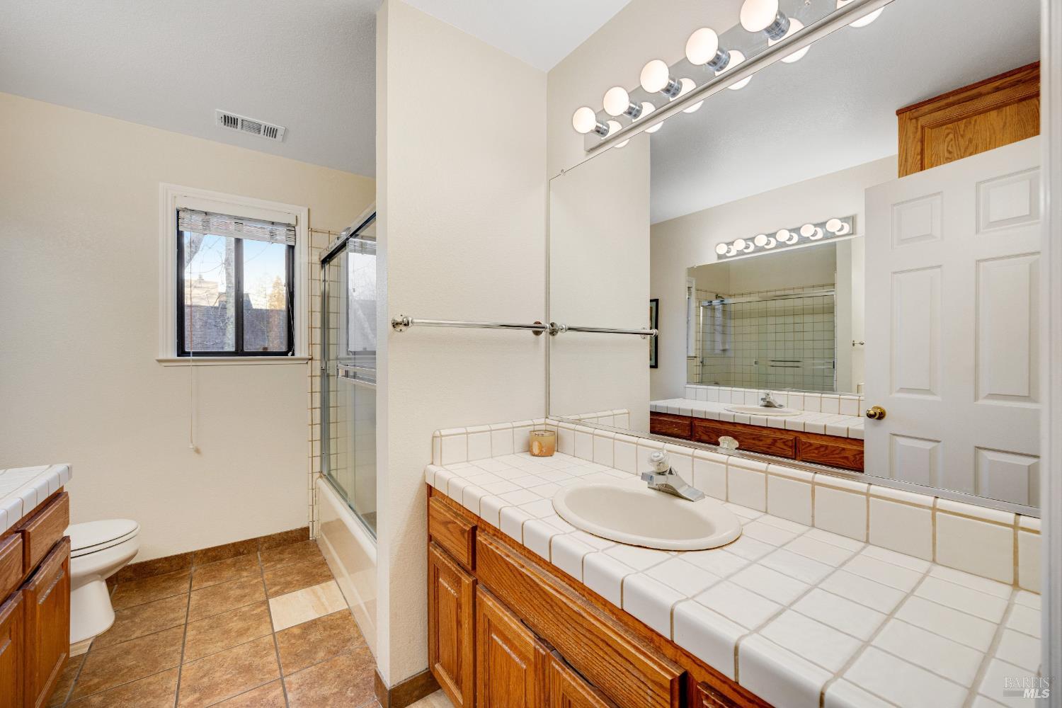 504 Jenifer Court Santa Rosa, CA 95404 - Photo 45 of 61 a bathroom with a sink and a mirror