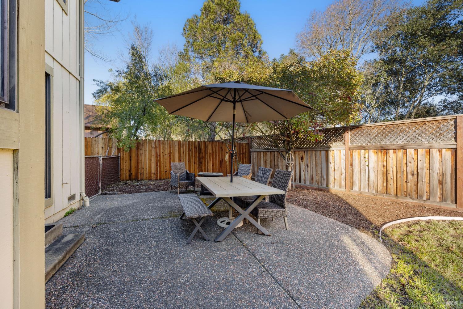 504 Jenifer Court Santa Rosa, CA 95404 - Photo 61 of 61 a backyard of a house with table and chairs